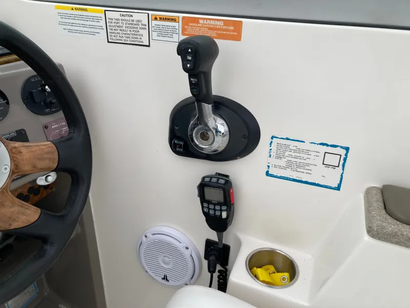 Slide: The Image of 2007 Rinker 280 Express Cruiser helm with throttle control. - 15