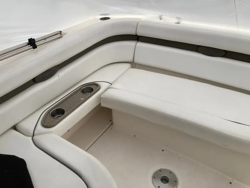 Slide: The Image of Interior of a 2007 Rinker 280 Express Cruiser with white seating. - 17