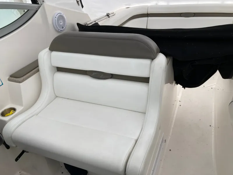 Slide: The Image of Interior of a 2007 Rinker 280 Express Cruiser with white seating. - 18