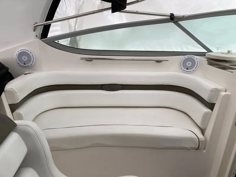 Slide: The Image of Interior of a 2007 Rinker 280 Express Cruiser with white seating. - 19