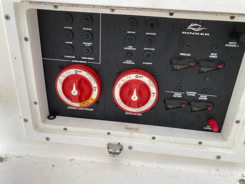 Slide: The Image of Control panel of 2007 Rinker 280 Express Cruiser with battery and generator switches. - 23