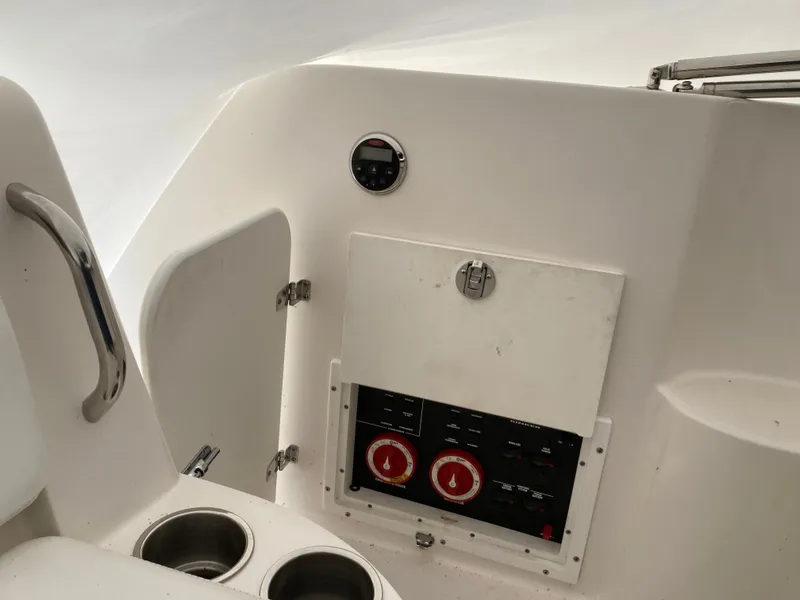 Slide: The Image of 2007 Rinker 280 Express Cruiser control panel with gauges. - 25