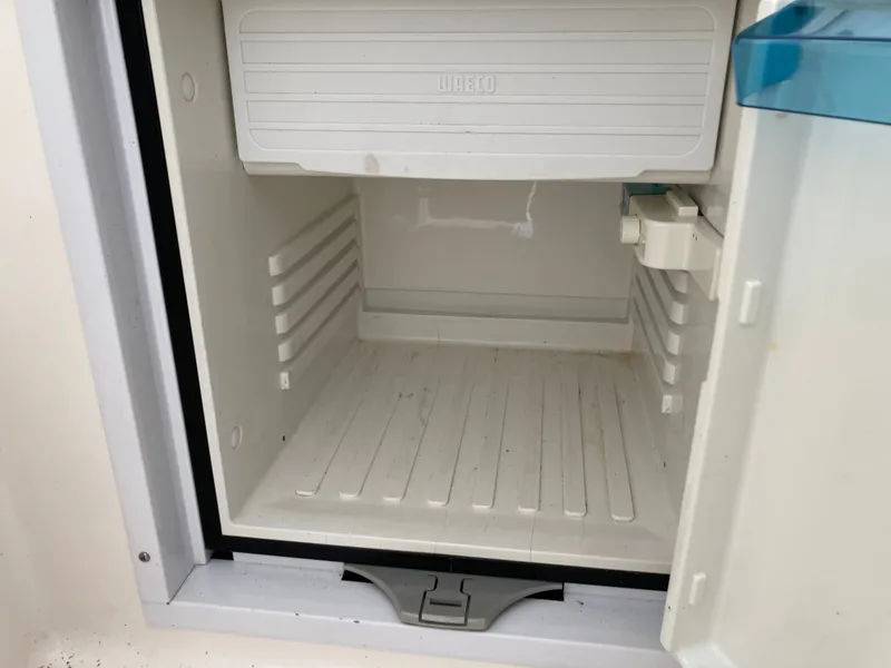 Slide: The Image of Empty fridge in 2007 Rinker 280 Express Cruiser. - 27