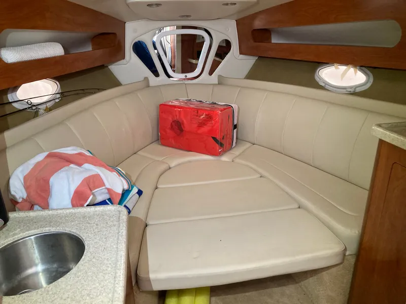 Slide: The Image of Interior of a 2007 Rinker 280 Express Cruiser with seating area. - 31