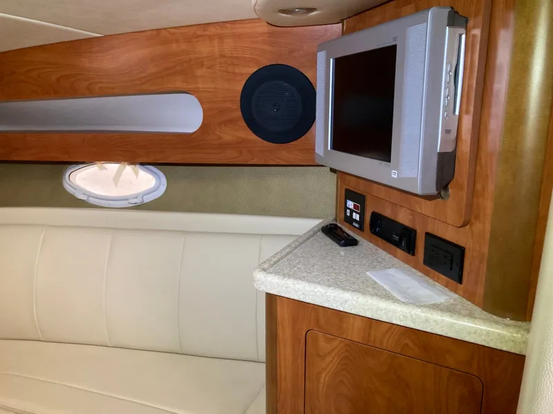 Slide: The Image of Interior of 2007 Rinker 280 Express Cruiser with TV and seating area. - 32