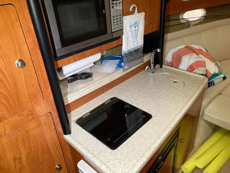 Slide: The Image of Galley area in a 2007 Rinker 280 Express Cruiser yacht. - 35