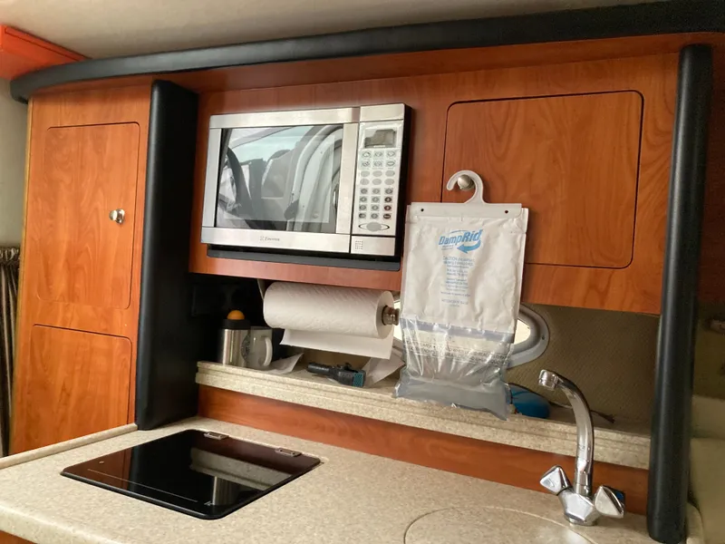 Slide: The Image of Galley in a 2007 Rinker 280 Express Cruiser with microwave. - 37