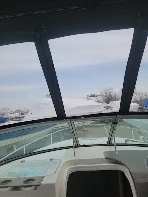 Slide: The Image of 2007 Rinker 280 Express Cruiser wrapped and propped outdoors. - 4