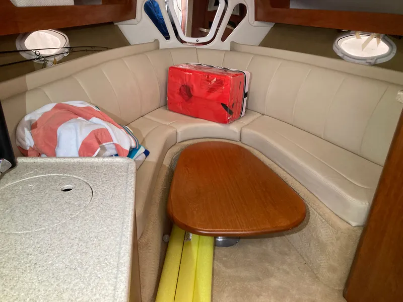 Slide: The Image of Interior of 2007 Rinker 280 Express Cruiser with seating area. - 40