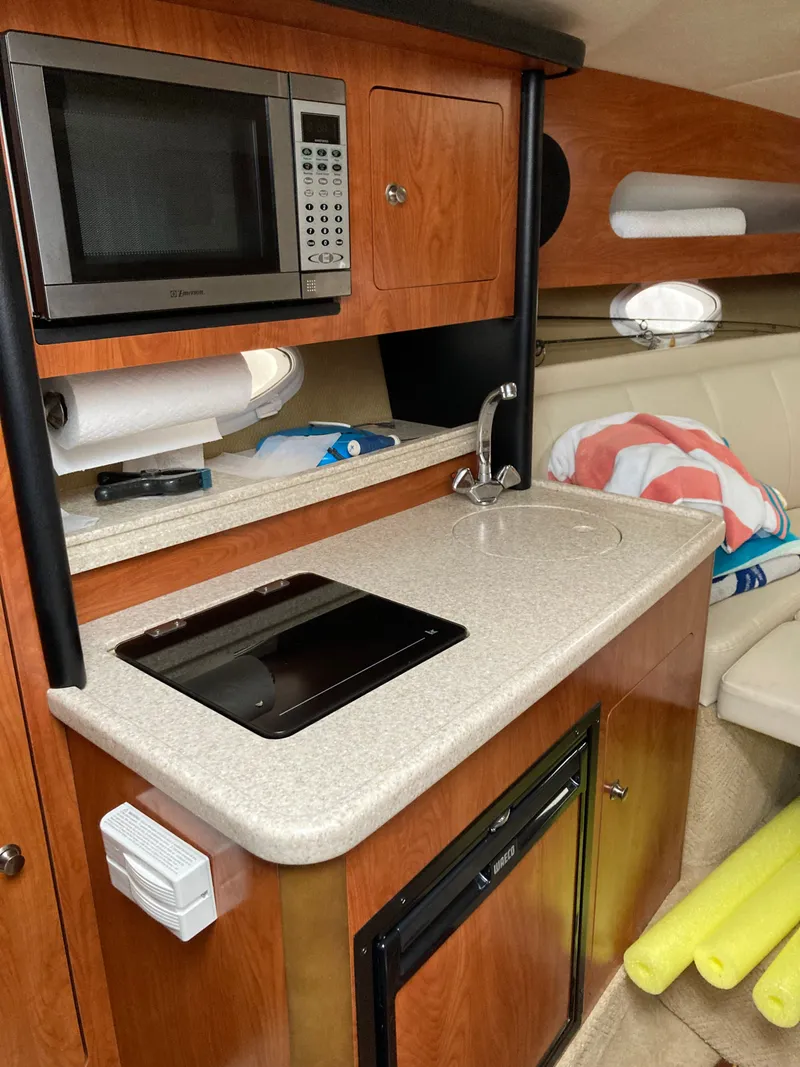 Slide: The Image of Interior of 2007 Rinker 280 Express Cruiser with kitchenette. - 41