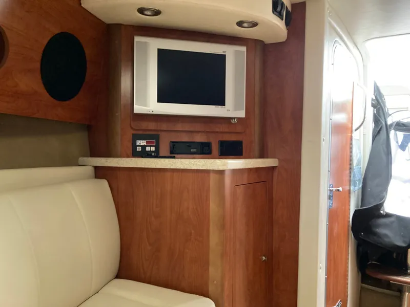 Slide: The Image of Interior of 2007 Rinker 280 Express Cruiser with TV and seating area. - 42