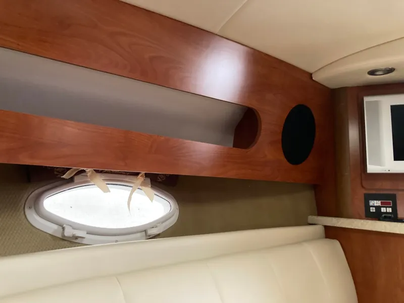 Slide: The Image of Interior of 2007 Rinker 280 Express Cruiser with wood paneling. - 44