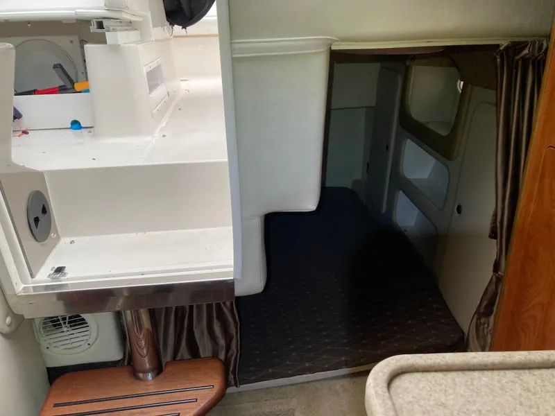 Slide: The Image of Interior of a 2007 Rinker 280 Express Cruiser with sleeping area. - 48