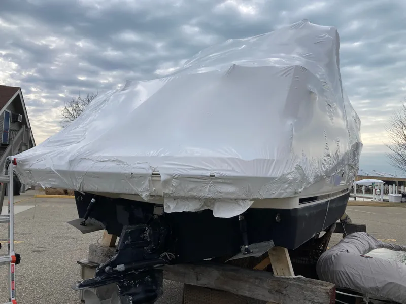 Slide: The Image of 2007 Rinker 280 Express Cruiser wrapped for winter storage. - 6