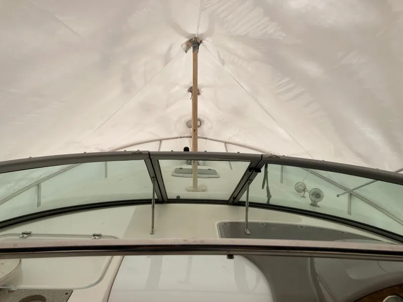 Slide: The Image of 2007 Rinker 280 Express Cruiser under cover, view of cockpit. - 7