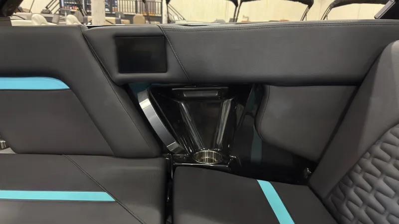 Slide: The Image of Interior of 2022 MasterCraft X22 with modern seating and blue accents. - 11