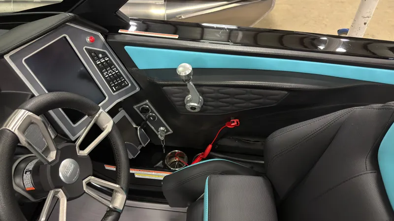 Slide: The Image of Interior of a 2022 MasterCraft X22 boat with modern dashboard. - 12