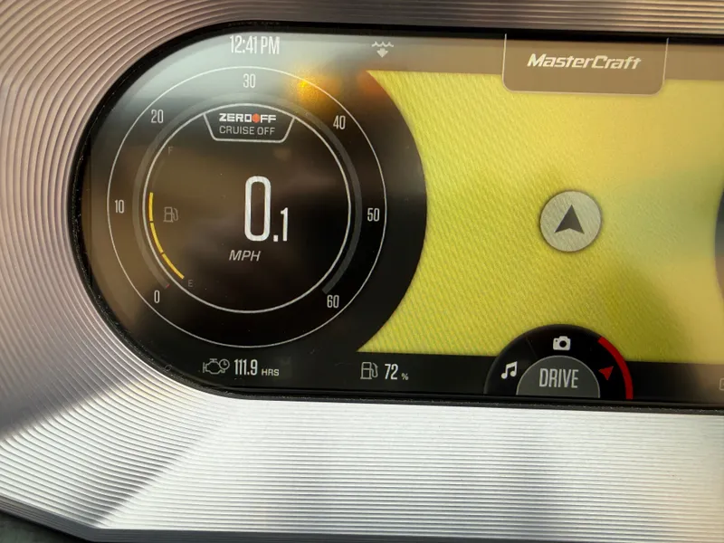 Slide: The Image of MasterCraft X22 2022 dashboard displaying speedometer and navigation system. - 14