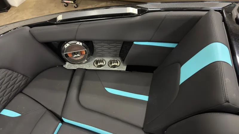 Slide: The Image of Interior of 2022 MasterCraft X22 with blue accents and speaker. - 16