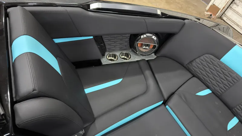 Slide: The Image of 2022 MasterCraft X22 interior with blue accents and speaker. - 17