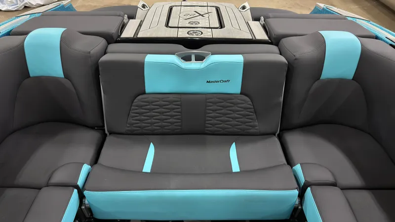 Slide: The Image of Interior of 2022 MasterCraft X22 with blue and gray seating. - 6