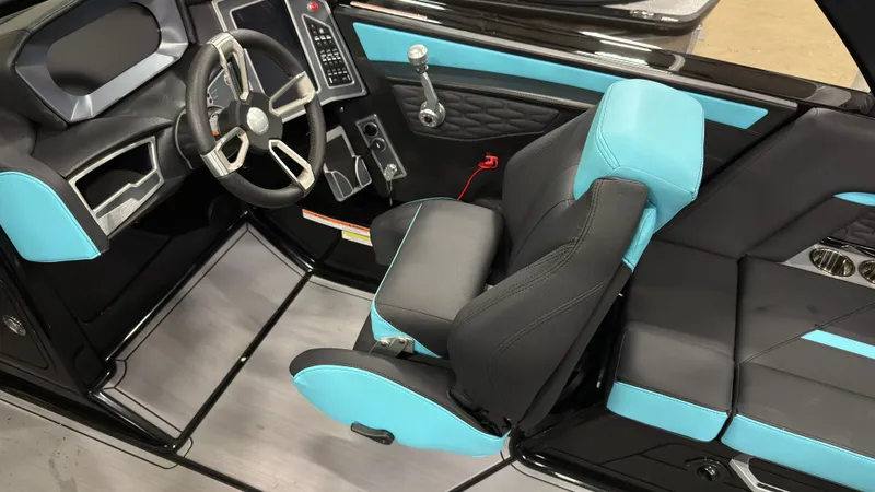 Slide: The Image of Interior of a 2022 MasterCraft X22 boat with blue and black seating. - 8