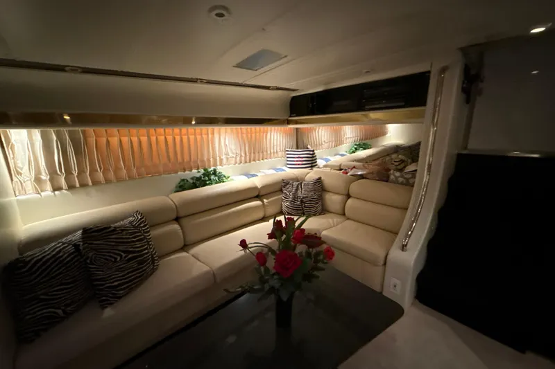 Slide: The Image of Luxurious interior of a 1999 Diaship 53 yacht with plush seating and elegant decor. - 11