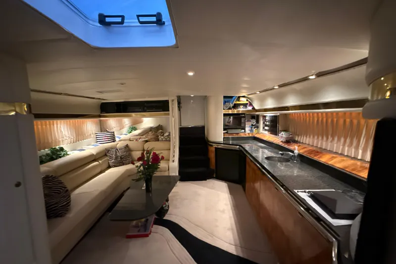 Slide: The Image of Luxurious interior of a 1999 Diaship 53 yacht with elegant seating and modern kitchen. - 12