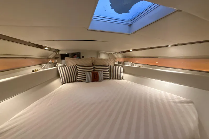 Slide: The Image of Luxurious cabin interior of 1999 Diaship 53 yacht with skylight and striped pillows. - 15