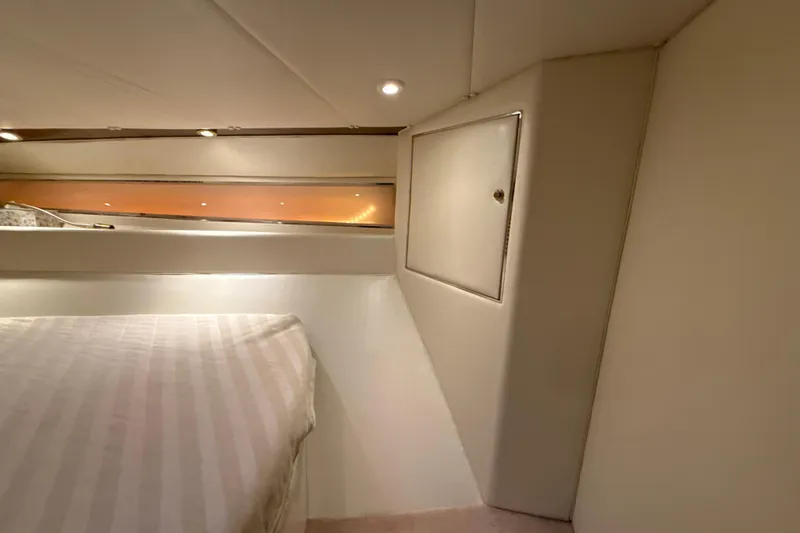 Slide: The Image of Interior cabin of 1999 Diaship 53 yacht with bed and storage compartment. - 16