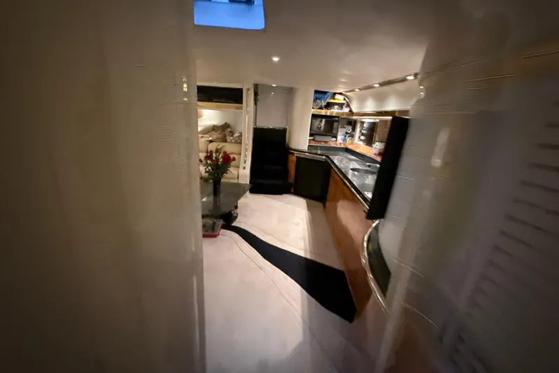 Slide: The Image of Luxurious interior of a 1999 Diaship 53 yacht with elegant furnishings and ambient lighting. - 18