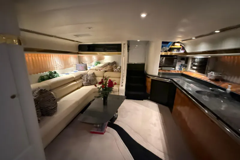 Slide: The Image of Luxurious interior of a 1999 Diaship 53 yacht with elegant seating and modern kitchen. - 19