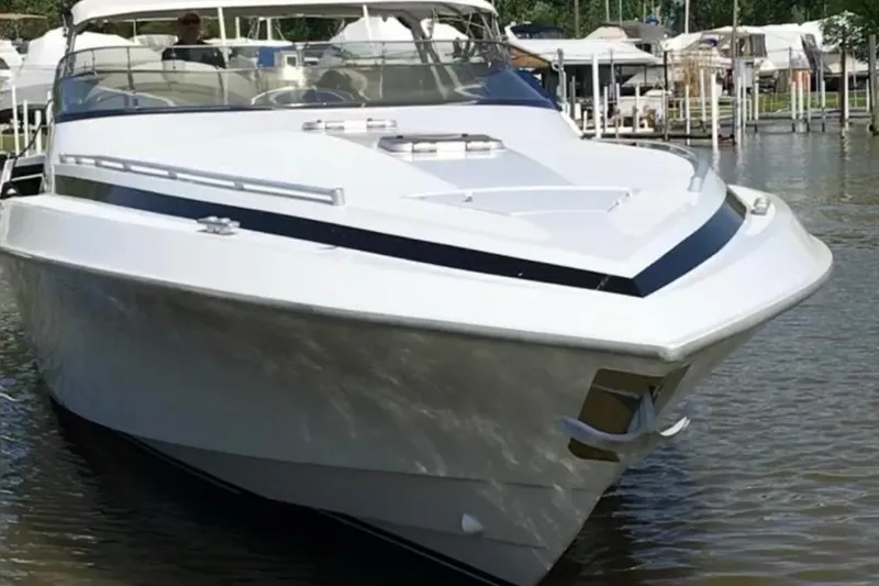 Slide: The Image of Luxury Diaship 53 yacht from 1999 docked in a marina. - 2