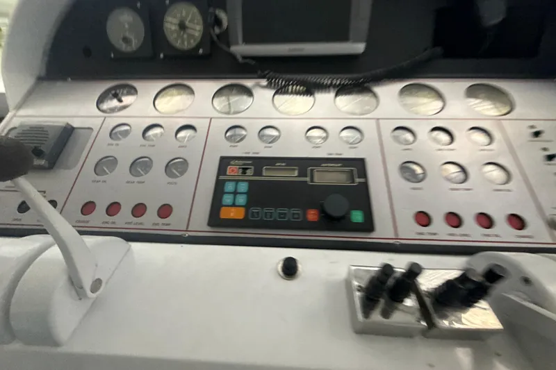 Slide: The Image of Control panel of a 1999 Diaship 53, featuring gauges and switches. - 32