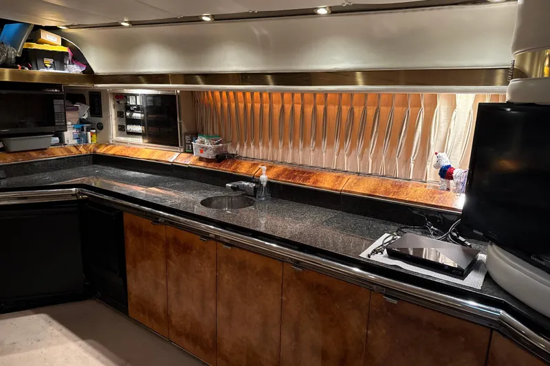 Slide: The Image of Luxurious kitchen interior of a 1999 Diaship 53 yacht with modern amenities. - 4