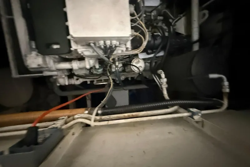 Slide: The Image of Close-up of Diaship 53 engine components, showcasing intricate wiring and tubing, 1999 model. - 50