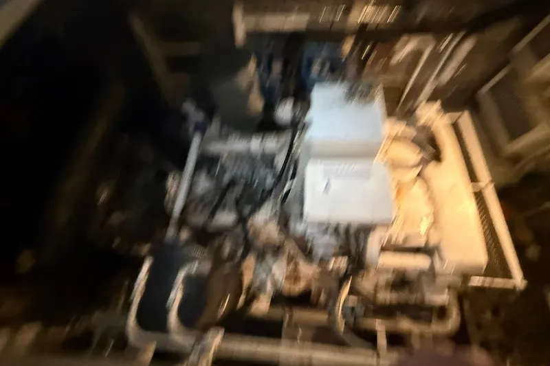 Slide: The Image of Blurry image of a Diaship 53 engine room, model year 1999. - 58