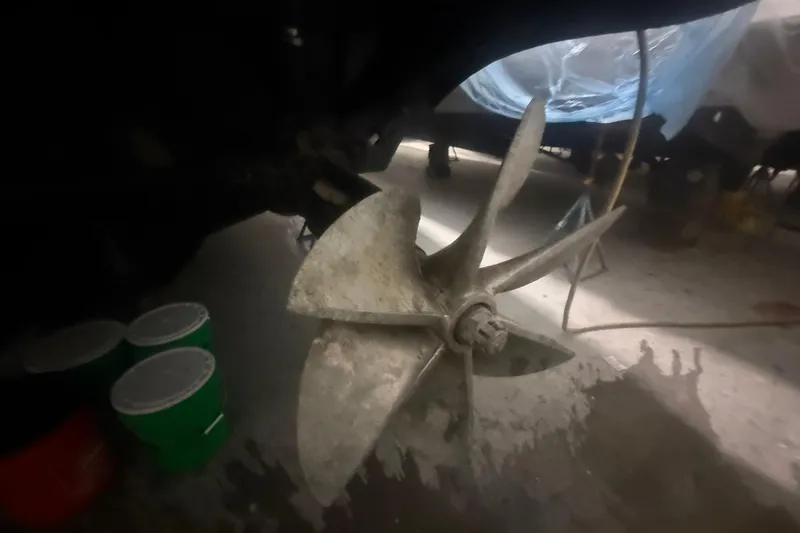 Slide: The Image of Propeller of a 1999 Diaship 53 boat in a workshop setting. - 71