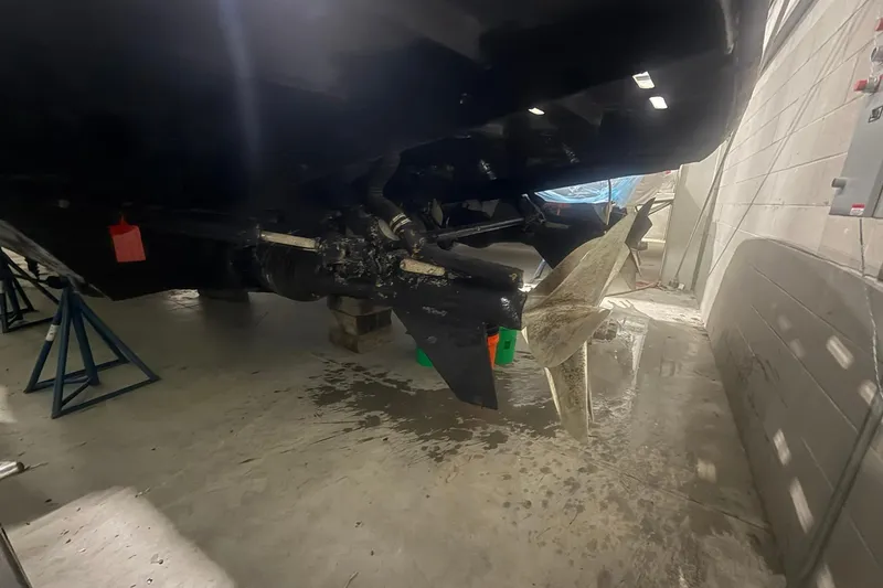 Slide: The Image of Underwater view of a 1999 Diaship 53 boat propeller in a maintenance facility. - 74