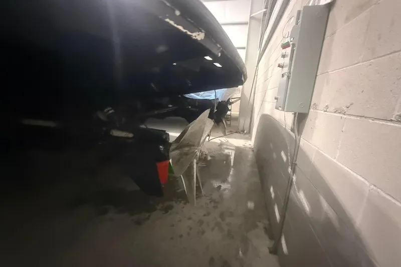 Slide: The Image of Boat propeller and rudder of a 1999 Diaship 53 in a garage setting. - 76