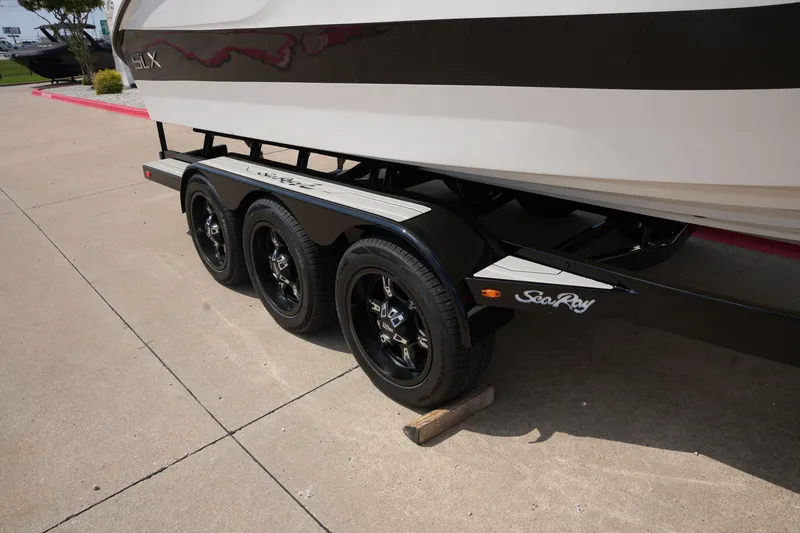 Slide: The Image of 2025 Sea Ray SLX 260 Surf on trailer, side view. - 3
