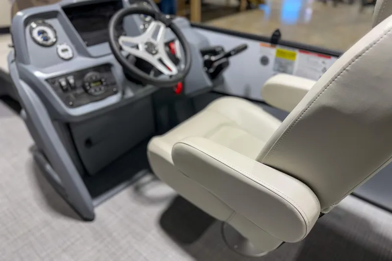 Slide: The Image of Interior of 2026 Sylvan A20 boat showing steering wheel and captain's chair. - 5