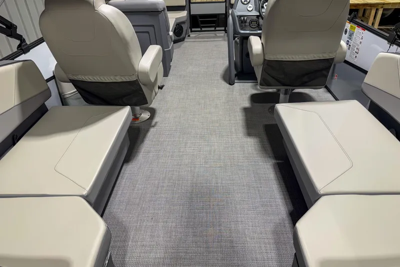 Slide: The Image of Interior of 2026 Sylvan A20 boat with beige seating and modern design. - 6