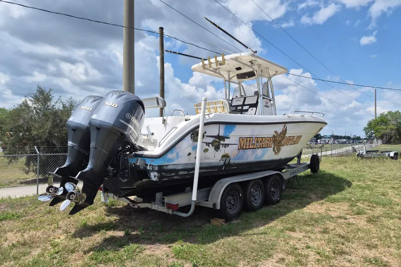 The Image of 2006 Century 2900 Center Console boat with twin Yamaha engines on a trailer. - 1