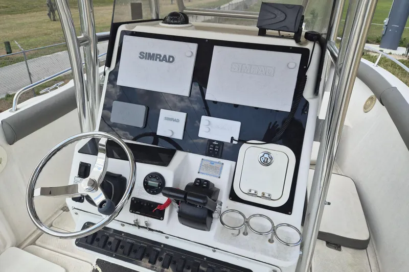 Slide: The Image of Center console of a 2006 Century 2900 boat with Simrad electronics. - 10