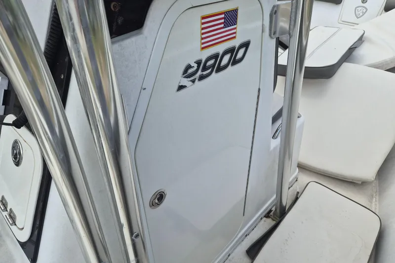 Slide: The Image of 2006 Century 2900 Center Console boat with American flag decal and stainless steel railings. - 12