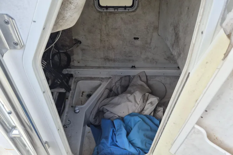 Slide: The Image of Interior cabin of a 2006 Century 2900 Center Console boat with stored items. - 13