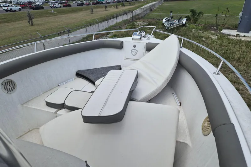 Slide: The Image of 2006 Century 2900 Center Console boat with cushioned seating and storage area. - 14