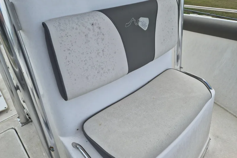 Slide: The Image of Boat seat on a 2006 Century 2900 Center Console, featuring white and gray upholstery. - 15
