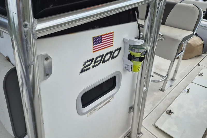 Slide: The Image of 2006 Century 2900 Center Console boat with American flag decal and safety equipment. - 17